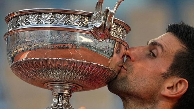 Novak Djokovic kisses the cup after winning the French Open. (Photo / AP)