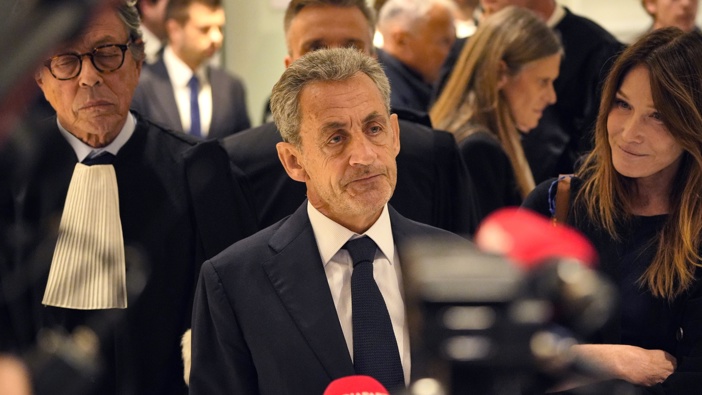 Former French president Nicolas Sarkozy and with wife Carla Bruni addresses the press after he was found guilty on September 25, 2025 in Paris, France. (Photo by Remon Haazen/Getty Images)