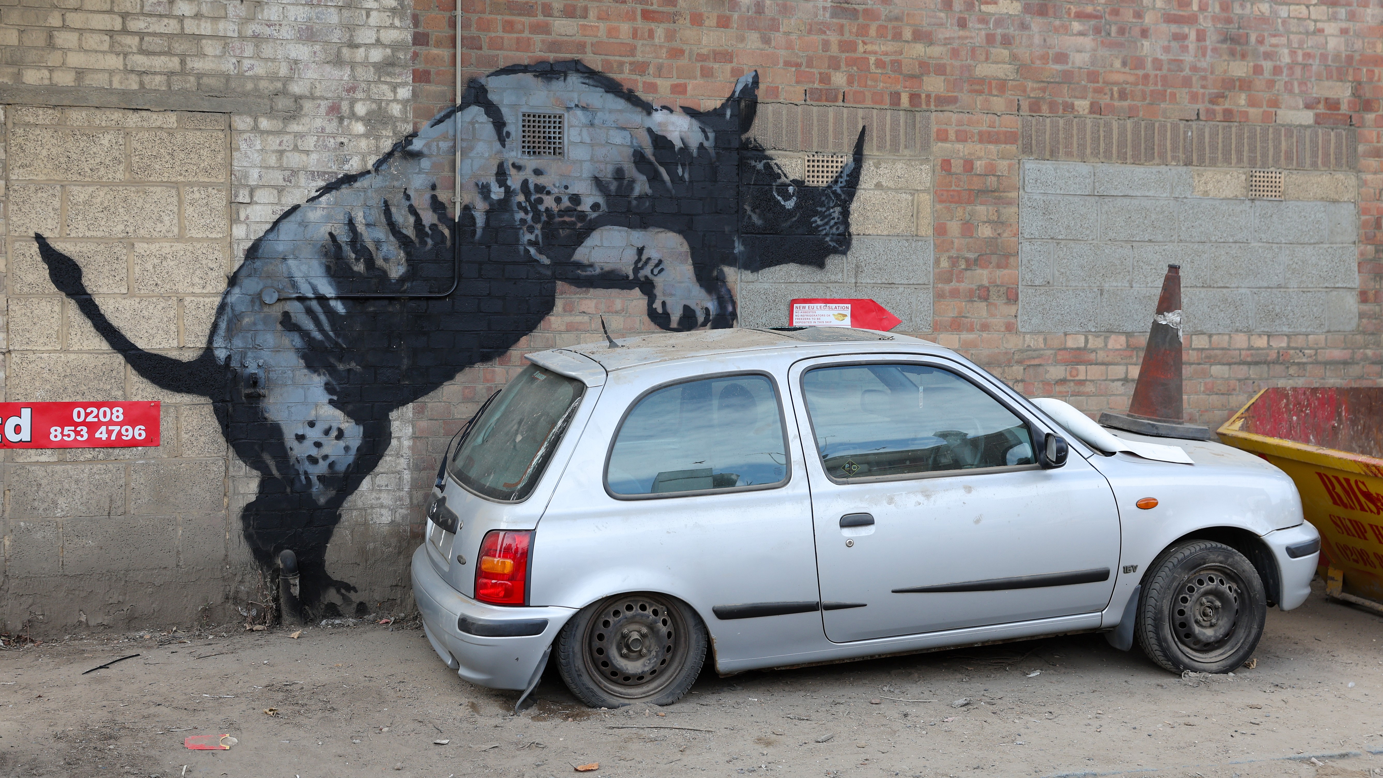 A painting of a rhinoceros purportedly by Banksy adorns a wall on August 12, 2024 in the Charlton area of London, England. (Photo by Simone Joyner/Getty Images)