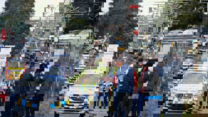 Police attend an incident on the Auckland southern train line. Photo / Alex Burton