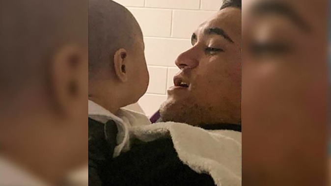Jahden Nelson with his baby daughter. He suffered an electric shock while working as a scaffolder. Photo / Supplied