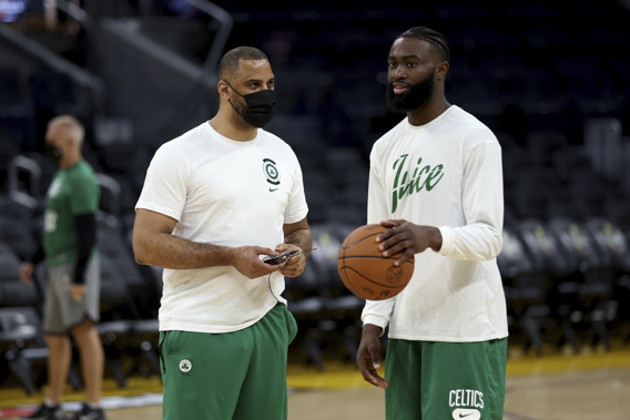 Boston Celtics guard Jaylen Brown, right, speaks with coach Ime Udoka during NBA basketball. Photo / AP