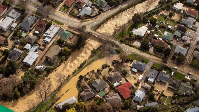 An aerial picture shows the flooding of properties in Nelson's Nile St on August 20. Photo / Tim Cuff