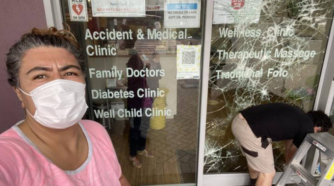 Josephine Bartley outside the Pasefika Family Health Group centre, which is also a Covid vaccine site, after it was vandalised. (Photo / Twitter)