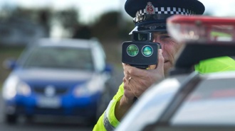 Mum caught driving at 140km/h 'was busy telling kids off'