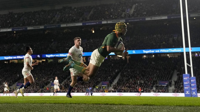 South Africa's Kurt-Lee Arendse scores a try at Twickenham. Photo / AP