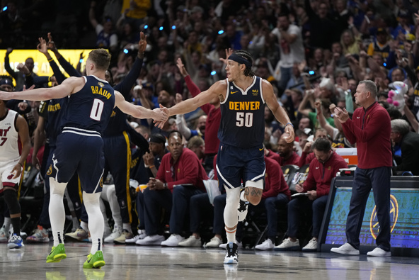 Denver Nuggets forward Aaron Gordon (50) celebrates with guard Christian Braun (0) after scoring against the Miami Heat during the first half of Game 2 of basketball's NBA Finals, Sunday, June 4, 2023, in Denver. Photo / AP