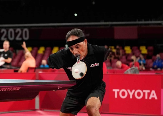 Ibrahim Hamadtou of Egypt plays against Park Hong-kyu of South Korea in Class 6, Group E of men's table tennis at the Tokyo 2020 Paralympic Games. (Photo / AP)
