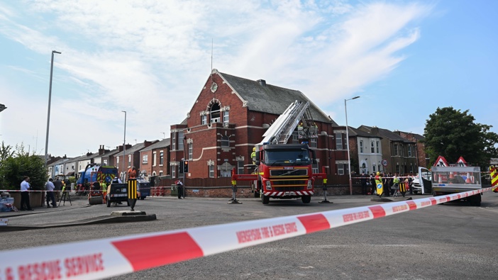 Teams repair the road and garden walls around the Southport Islamic Society Mosque that has been attacked by the far-right extremists, following a knife attack in which 3 children were killed and 10 people, including 8 children, were injured in Southport, UK on July 31, 2024. (Photo by Rasid Necati Aslim/Anadolu via Getty Images)