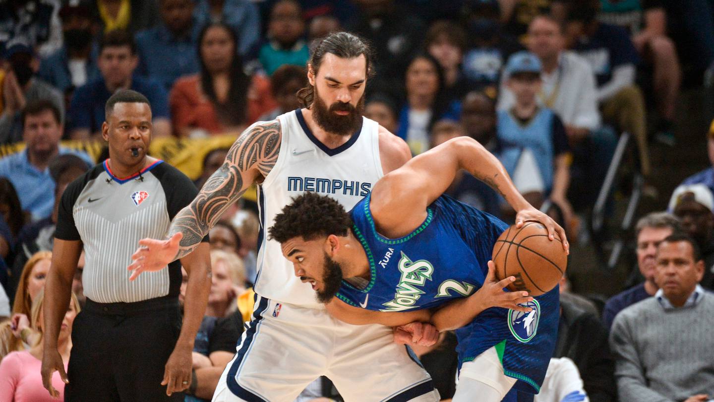 Minnesota Timberwolves centre Karl-Anthony Towns handles the ball against Memphis Grizzlies centre Steven Adams during the first half. Photo / AP