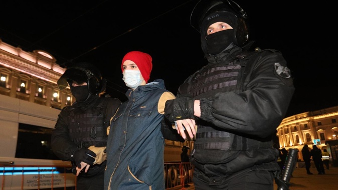 Russian security forces detain demonstrators as they stage an anti-war demonstration in St Petersburg. Photo / Getty Images