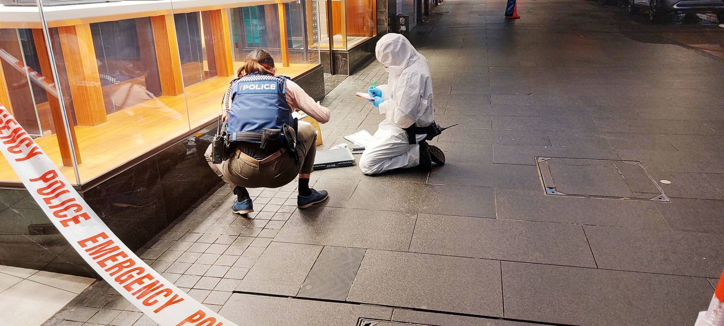 Police staff at the scene outside of a jewellery store in Queen Street. (Photo / Supplied)