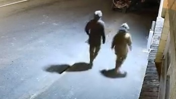 Caught on camera: Masked fugitive father Tom Phillips and child behind break-in, police say