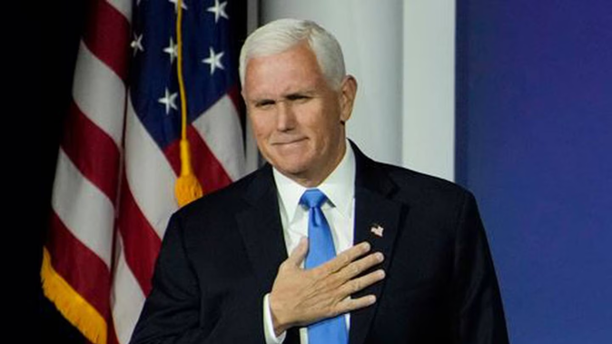 Former Vice President Mike Pence reacts as he walks on stage to speak at an annual leadership meeting of the Republican Jewish Coalition. Photo / AP