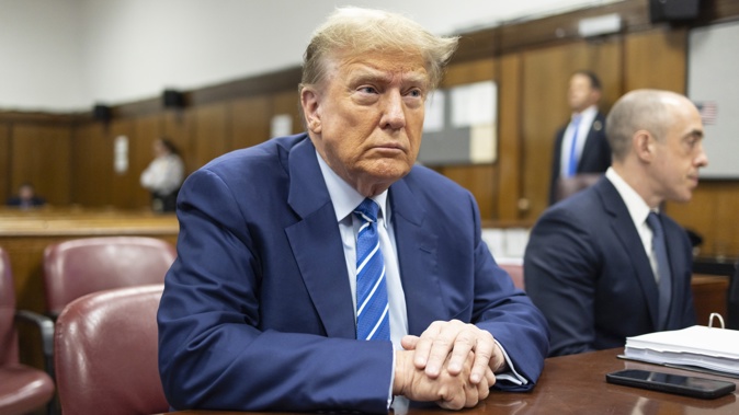 Former President Donald Trump awaits the start of proceedings on the second day of jury selection at Manhattan criminal court, Tuesday, April 16, 2024, in New York. Photo / AP