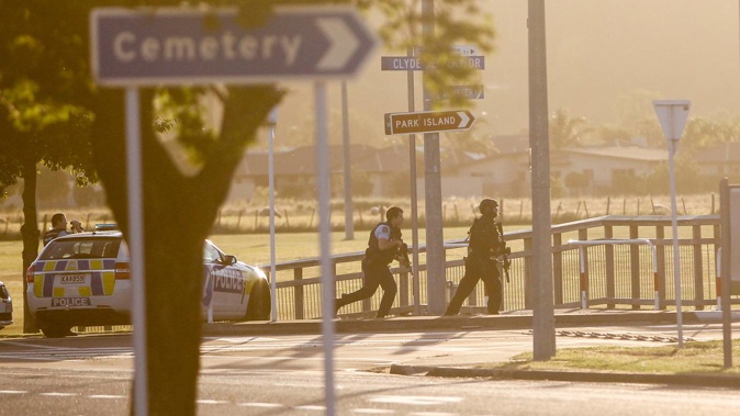 Armed police and Armed Offenders Squad members stormed Park Island during the shooting. (Photo / Paul Taylor)