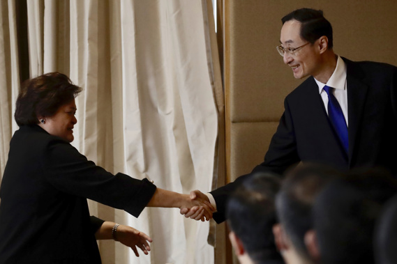 Filipino Foreign Affairs Undersecretary Theresa Lazaro, left, and Chinese Vice Foreign Minister Sun Weidong shake hands during a bilateral meeting in Manila, Philippines on Friday March 24, 2023.  Photo / AP