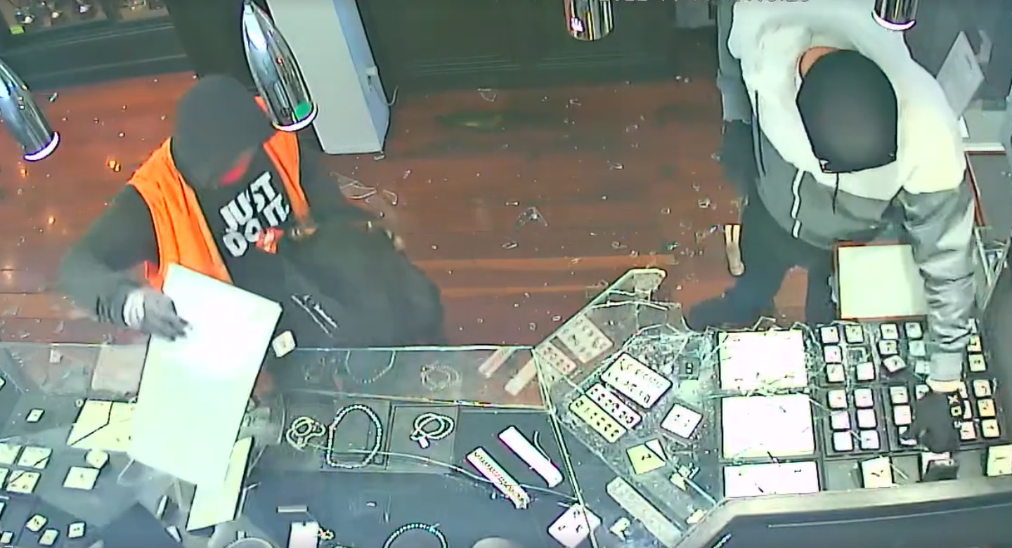 Two young men smash cabinets and take jewellery from Ellerslie Jewellers and Engravers during a heist last November.