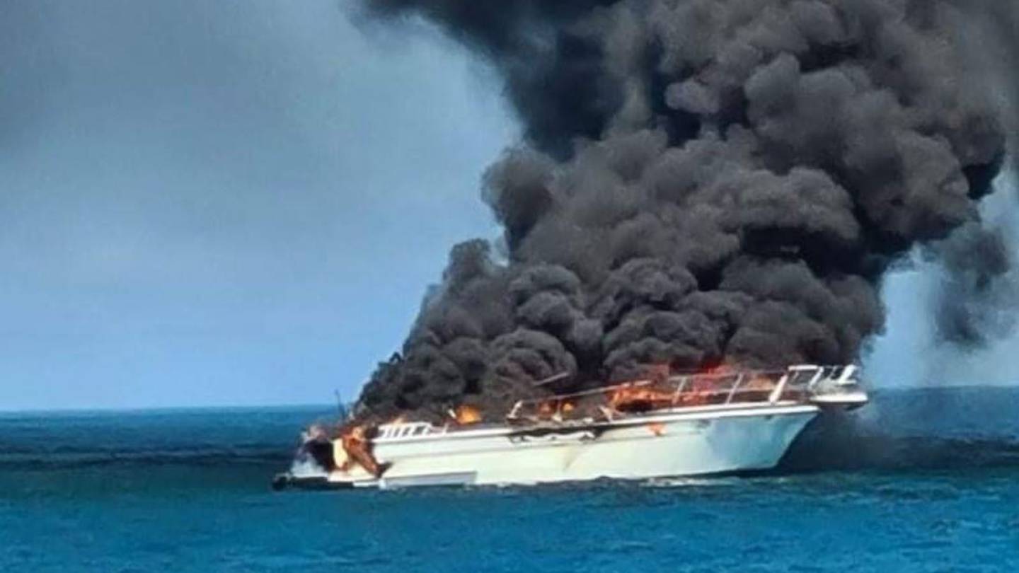 A boat caught fire off Wellington's south coast this afternoon. (Photo / Supplied)