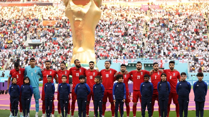Iran players line up for the national anthem before their match against England. Photo / Getty Images