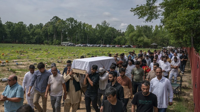 Friends and family carry the body of Nasrat Ahmad Yar, 31, to his grave during a funeral service at the All Muslim Association of America cemetery on July 8, in Fredericksburg, Virginia. Photo / AP
