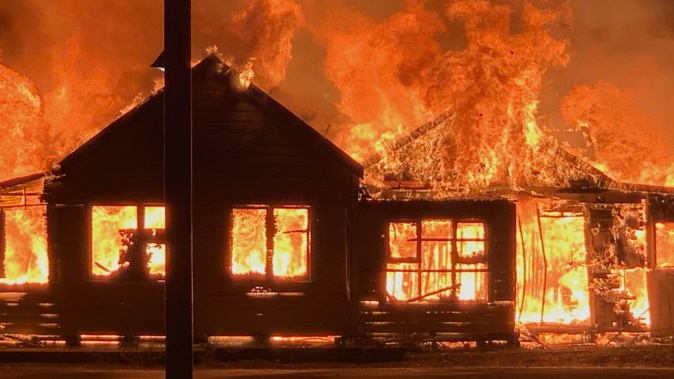 The century-old former backpackers lodge blaze as seen from Marine Parade minutes after the 12.15am alarm. Photo / Joe Hermon