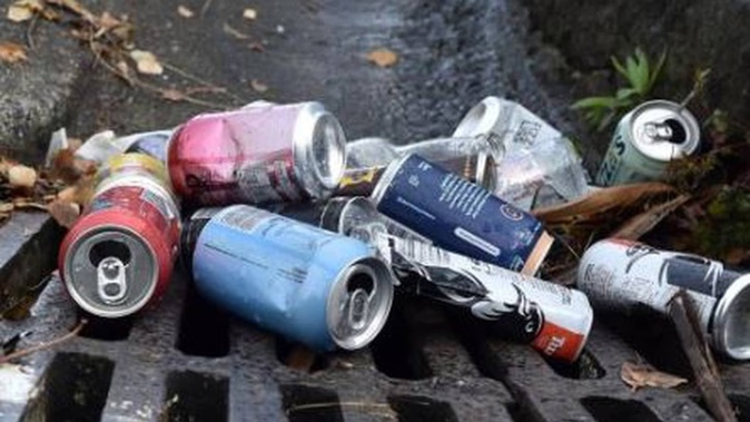 Bottles and cans pile up at the bottom of View St in central Dunedin after an out-of-control party was broken up by police. Photo / Peter McIntosh