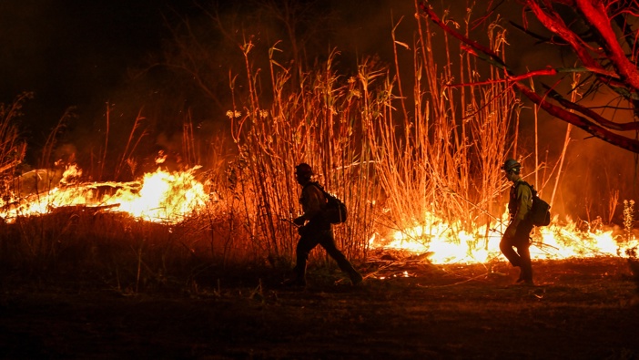 Crews are battling to brush fire near Auto Center Drive in Ventura, California, United States on January 13, 2025. (Photo by Tayfun Coskun/Anadolu via Getty Images)