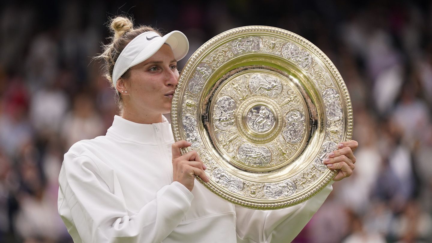 Czech Republic's Marketa Vondrousova celebrates with the trophy after beating Tunisia's Ons Jabeur in the women's singles final at the Wimbledon tennis championships in London. Photo / AP