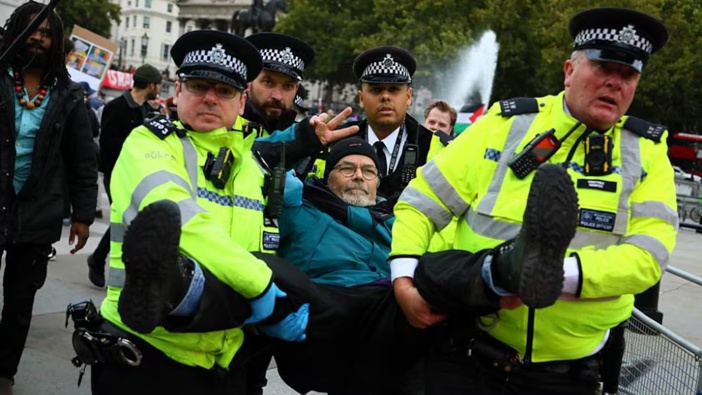 Police officers detain a demonstrator in Trafalgar Square during a protest in support of Palestine Action in London, England. Photo / Getty Images