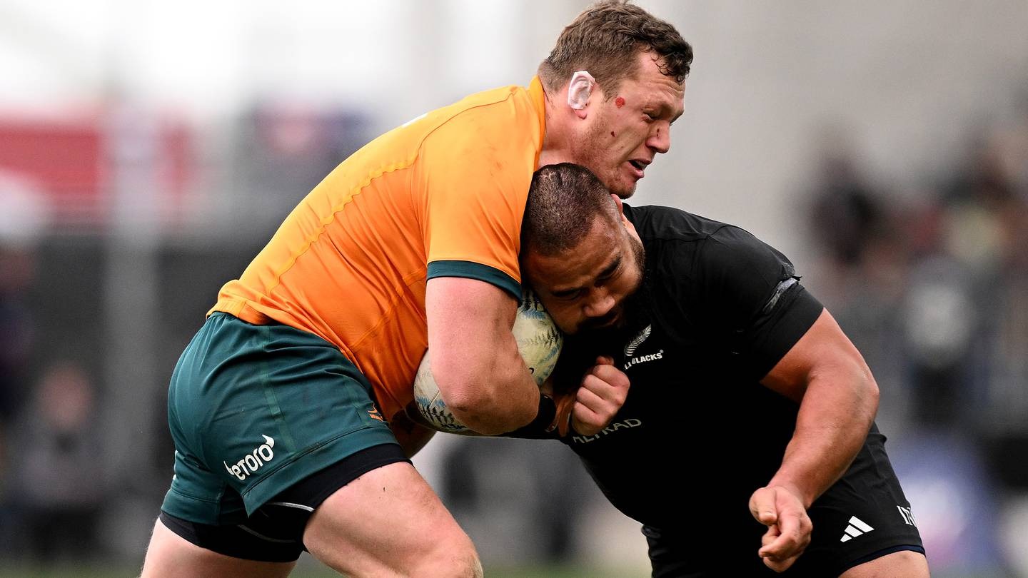 Angus Bell of Australia charges into Nepo Laulala. Photo / Getty