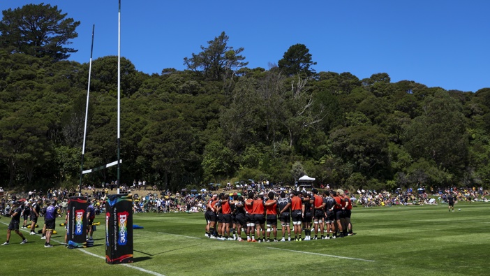 Hurricanes players form a huddle during the Super Rugby trial match between Hurricanes and Blues at Wainuiomata Rugby Football Club on February 07, 2025 in Lower Hutt, New Zealand. (Photo by Hagen Hopkins/Getty Images)