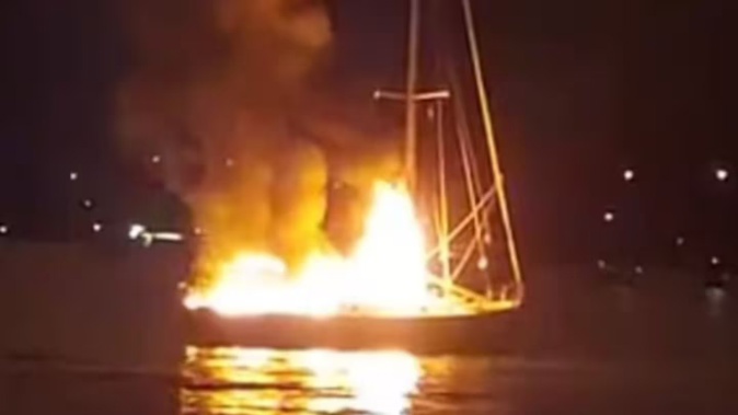 The yacht was set on fire in the Whitsundays. Photo / Facebook