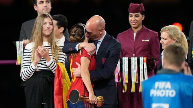 President of Spain's soccer federation, Luis Rubiales (right) hugs Spain's Aitana Bonmati on the podium following the national team's win in the final of Women's World Cup football against England. Photo / AP