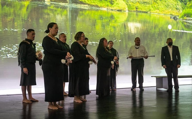 Whanganui River iwi members perform the tāngaengae ritual at dawn in the New Zealand Pavilion in Dubai. (Photo / NZ Herald)