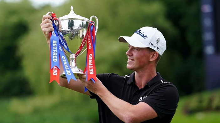 Daniel Hillier of New Zealand poses with the British Masters trophy. Photo / AP