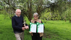 Rob and Tricia Noble-Beasley with their haul at the New Zealand Extra Virgin Olive Oil Awards. Photo / Rosalie Willis