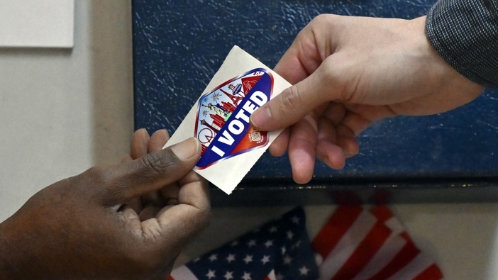 A voter receives a Las Vegas-themed "I Voted" sticker after casting their ballot inside the Galleria at Sunset mall on November 05, 2024 in Las Vegas, Nevada. Photo / Getty