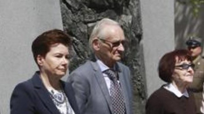 Warsaw Mayor Hanna Gronkiewicz-Waltz, left, with Andrzej Pilecki, centre, and Zofia Pilecka-Obtulowicz after unveiling a monument to Captain Witold Pilecki, in Warsaw, Poland. Photo / AP