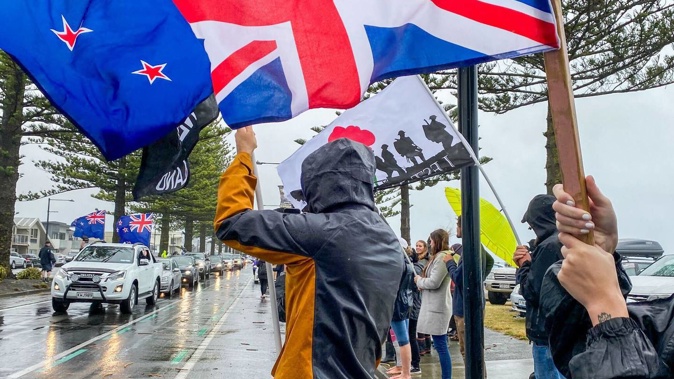 Protesters lined the street at Marine Parade on Monday to meet the convoy. Photo / Warren Buckland