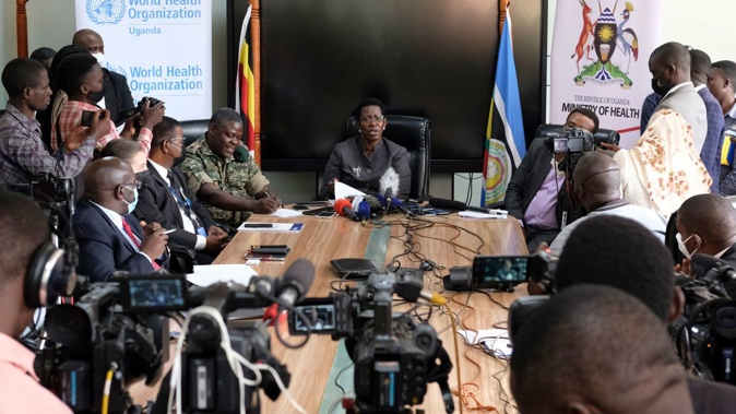 Permanent Secretary of the Ministry of Health Diana Atwine, center, confirms a case of Ebola in the country, at a press conference in Kampala, Uganda September 20