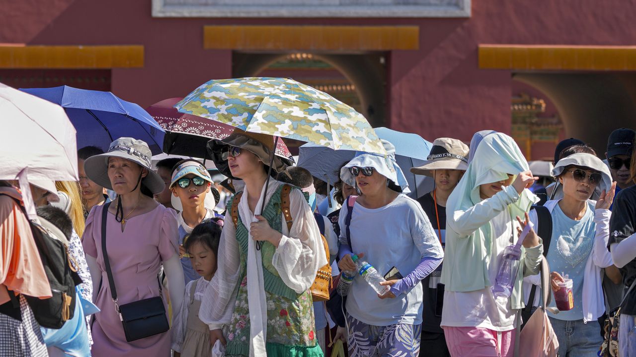 Visitors leaving the Forbidden City on a hot day in Beijing, Thursday, June 29, 2023. Andy Wong/AP