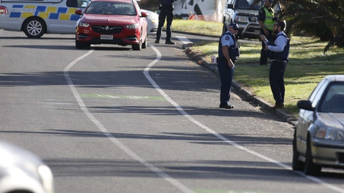 There is a heavy police presence in Peter Snell Drive in Ruakākā after two bodies were found at a house. Photo / Michael Cunningham