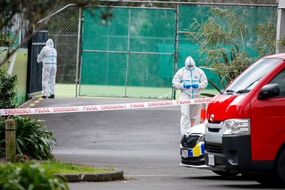 Police investigate the scene of a fatal stabbing at the Blockhouse Bay Tennis Club on Rathlin St. Photo / Dean Purcell.