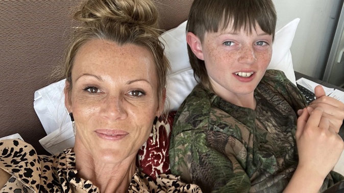 Clare Mooney, with son Charlie Read, said it took media involvement to get the cost of flights and accommodation refunded. Photo / Supplied