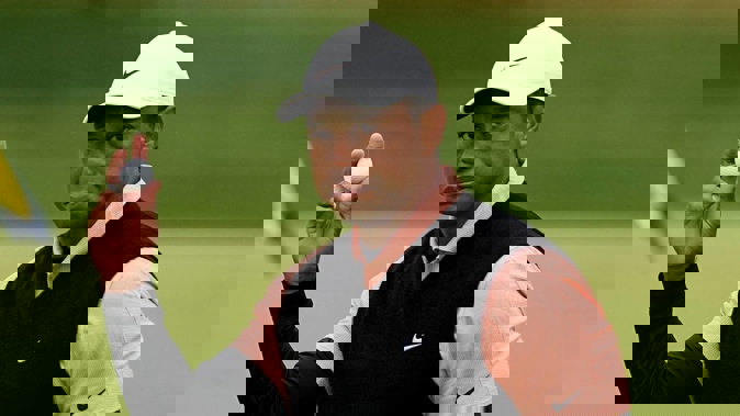 Tiger Woods waves after his third round on the 18th hole at the PGA Championship golf tournament at Southern Hills Country Club. Photo / AP