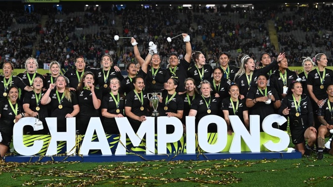 Black Ferns celebrate with the trophy after winning the Rugby World Cup final. Photo / Photosport