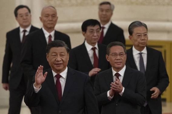 FILE - New members of the Politburo Standing Committee, front to back, President Xi Jinping, Li Qiang, Zhao Leji, Wang Huning, Cai Qi, Ding Xuexiang, and Li Xi arrive at the Great Hall of the People in Beijing on Oct. 23, 2022. The world faces the prospect of more tension with China over trade, security and human rights after Xi Jinping awarded himself a third five-year term on Oct. 23, 2022 as leader of the ruling Communist Party. (AP Photo/Ng Han Guan, File)