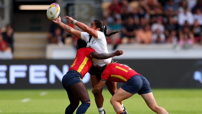 Winger Ayesha Leti-I'iga passes the ball in contact during the Black Ferns' win over Spain in York. Photo / Getty Images