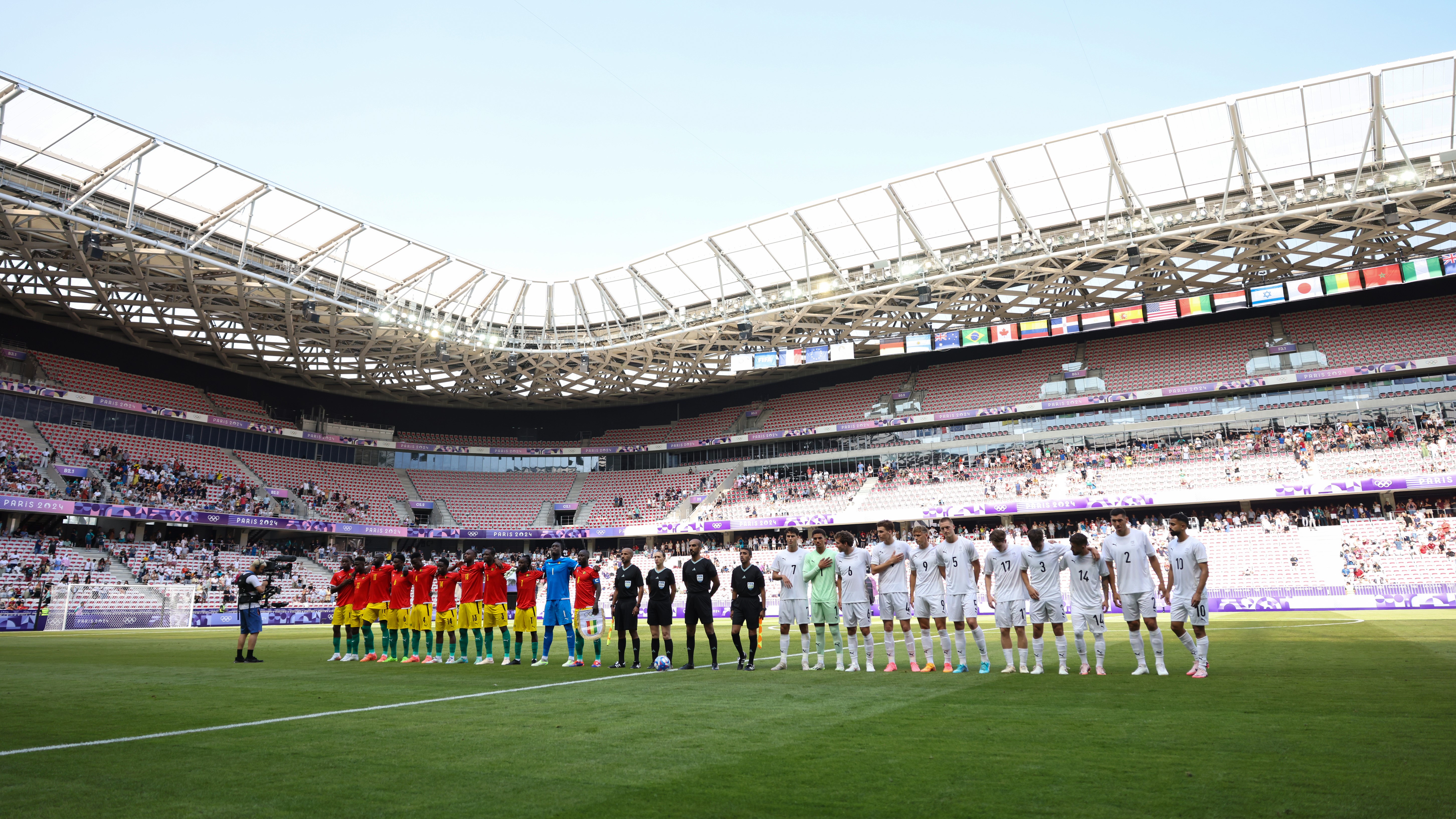 Players and Officials line up prior to the Men's group A match between Guinea v New Zealand during the Olympic Games Paris 2024 at Stade de Nice on July 24, 2024 in Nice, France. (Photo by Marc Atkins/Getty Images)